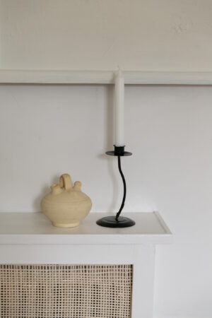 One-armed candle holder