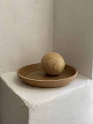 Rustic light-colored terracotta plate