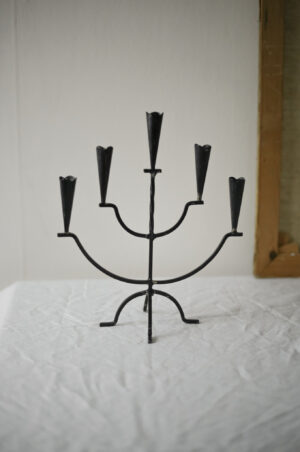 Five-armed black candle holder
