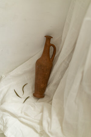 Antique terracotta spindle bottle