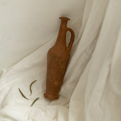 Antique terracotta spindle bottle