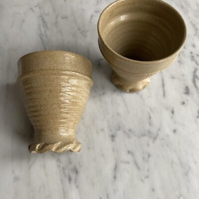 Handmade vintage stonewear cups with decorative pattern