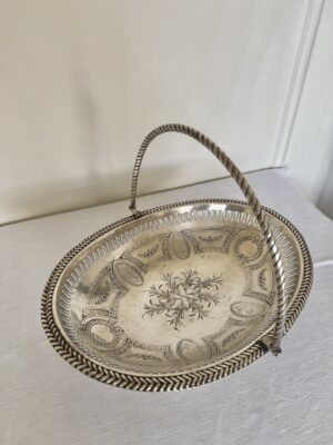 A superb antique silver swing handle basket with pierced work silver body and bead borders. Lovely classical style